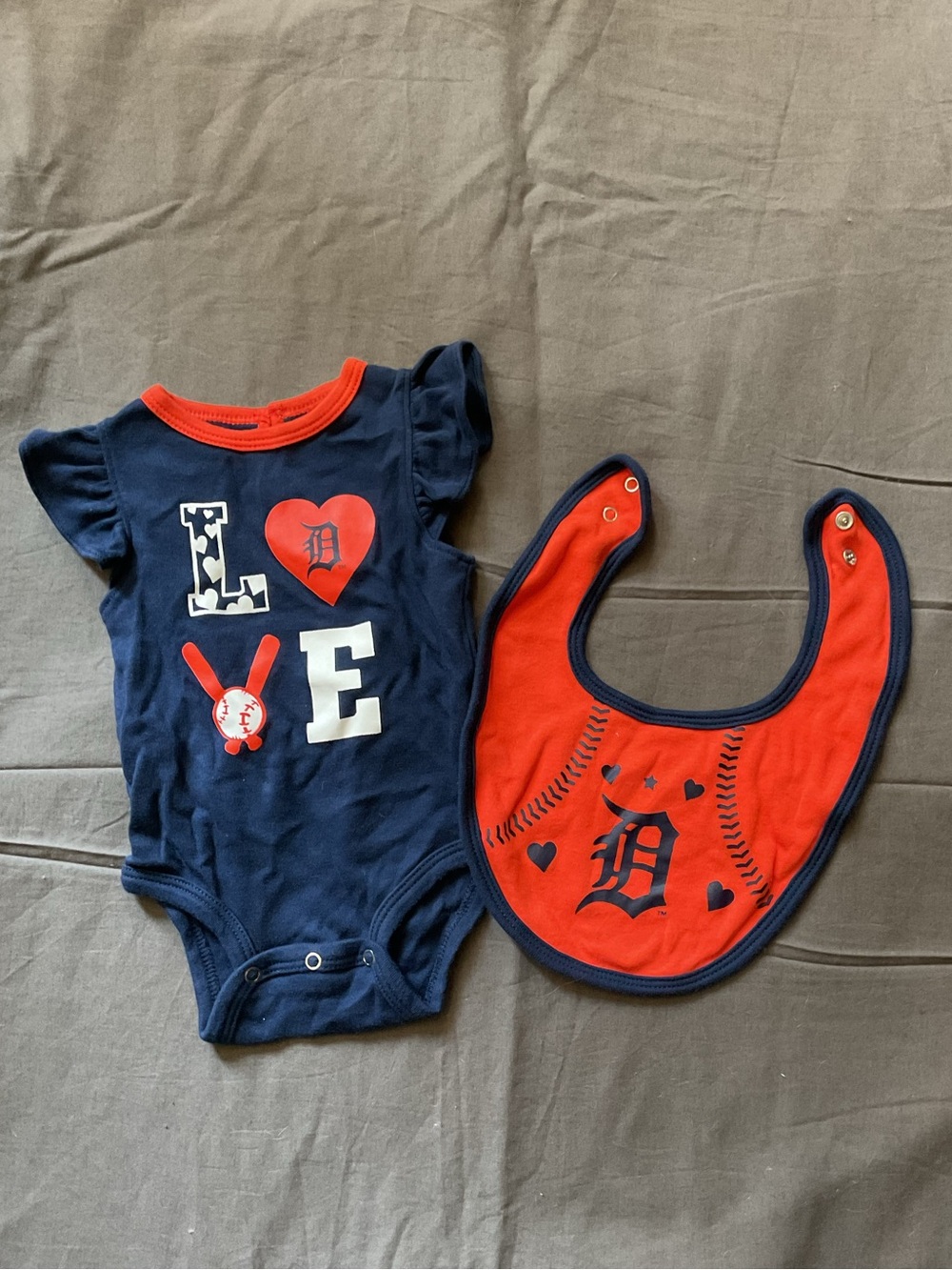 Genuine Merchandise Navy and Red Baby Bodysuit with Matching Bib